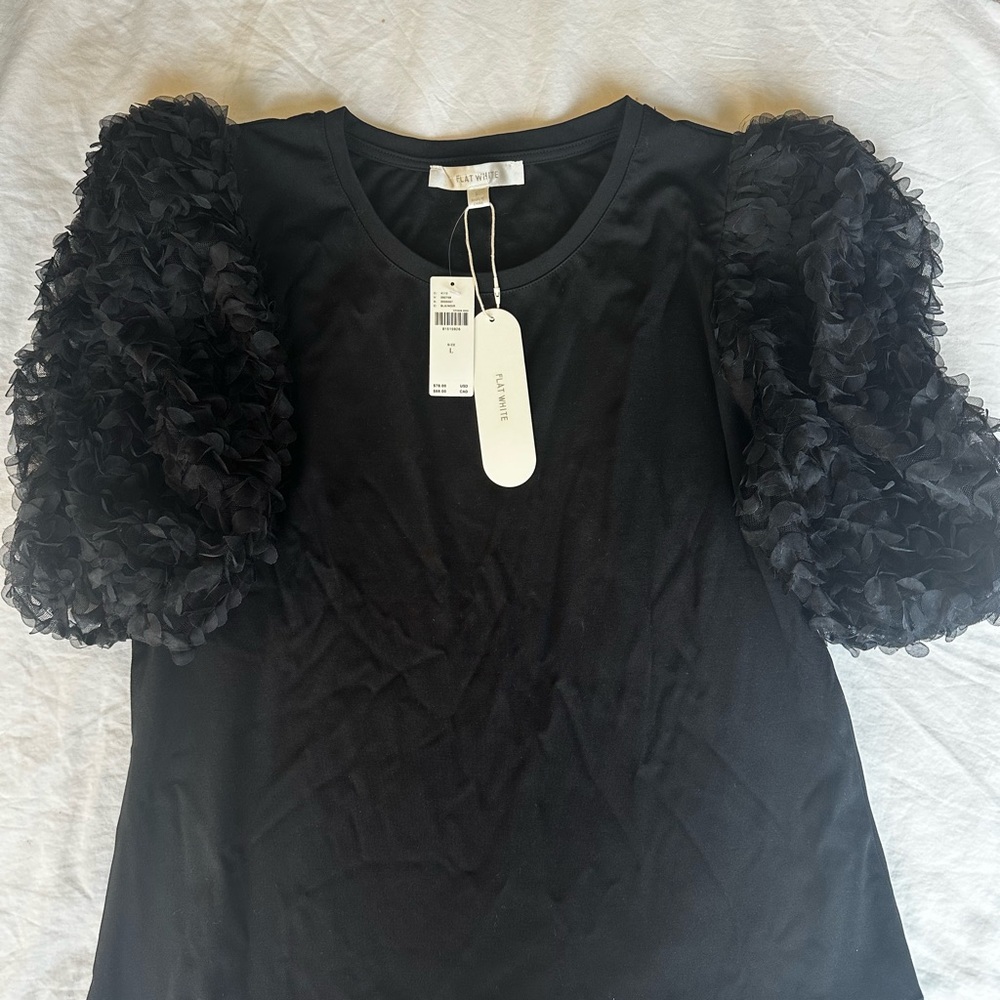 Flat white puff sleeve black top